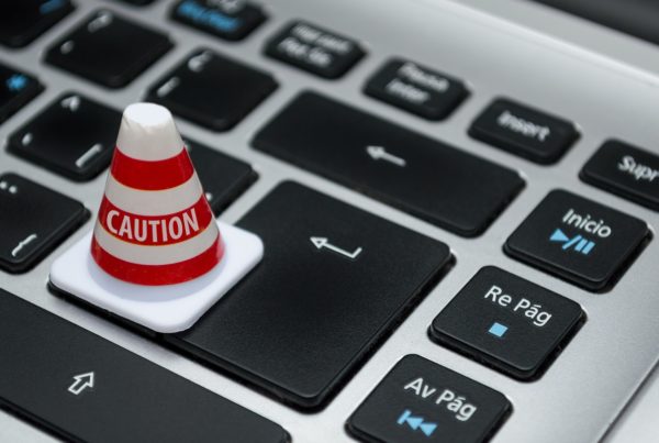 Cone saying caution on keyboard