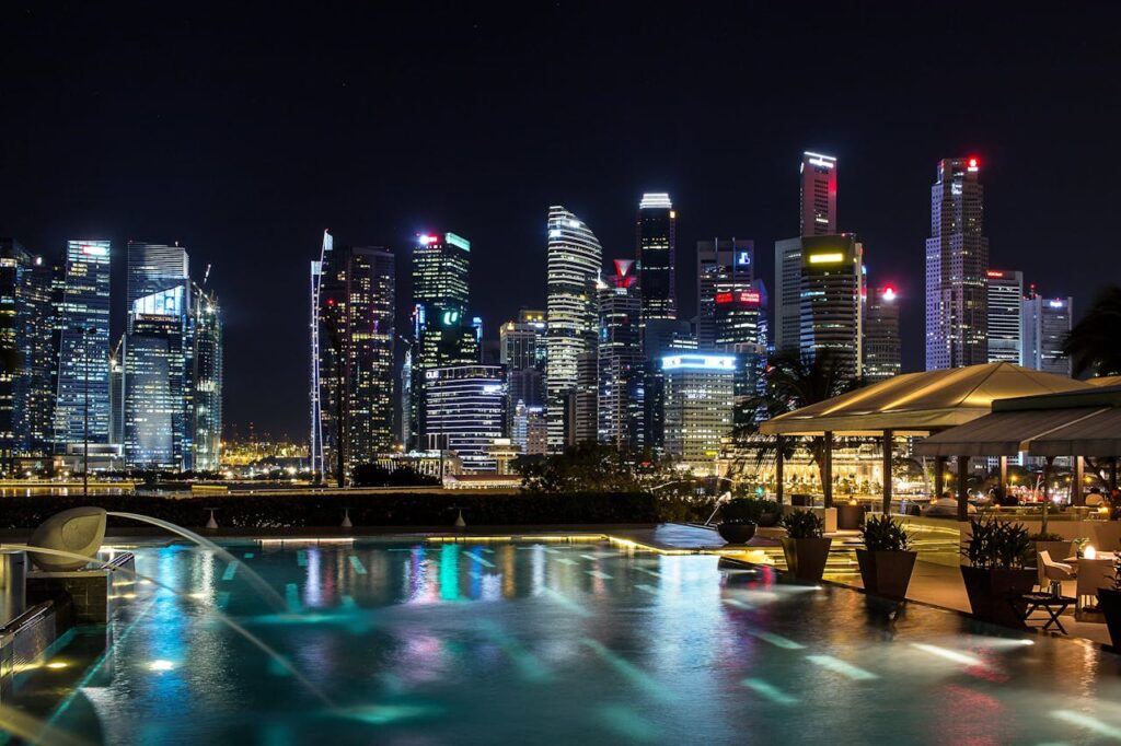 Modern hotel pool overlooking Singapore skyline