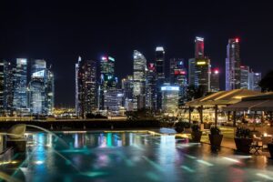 Modern hotel pool overlooking Singapore skyline