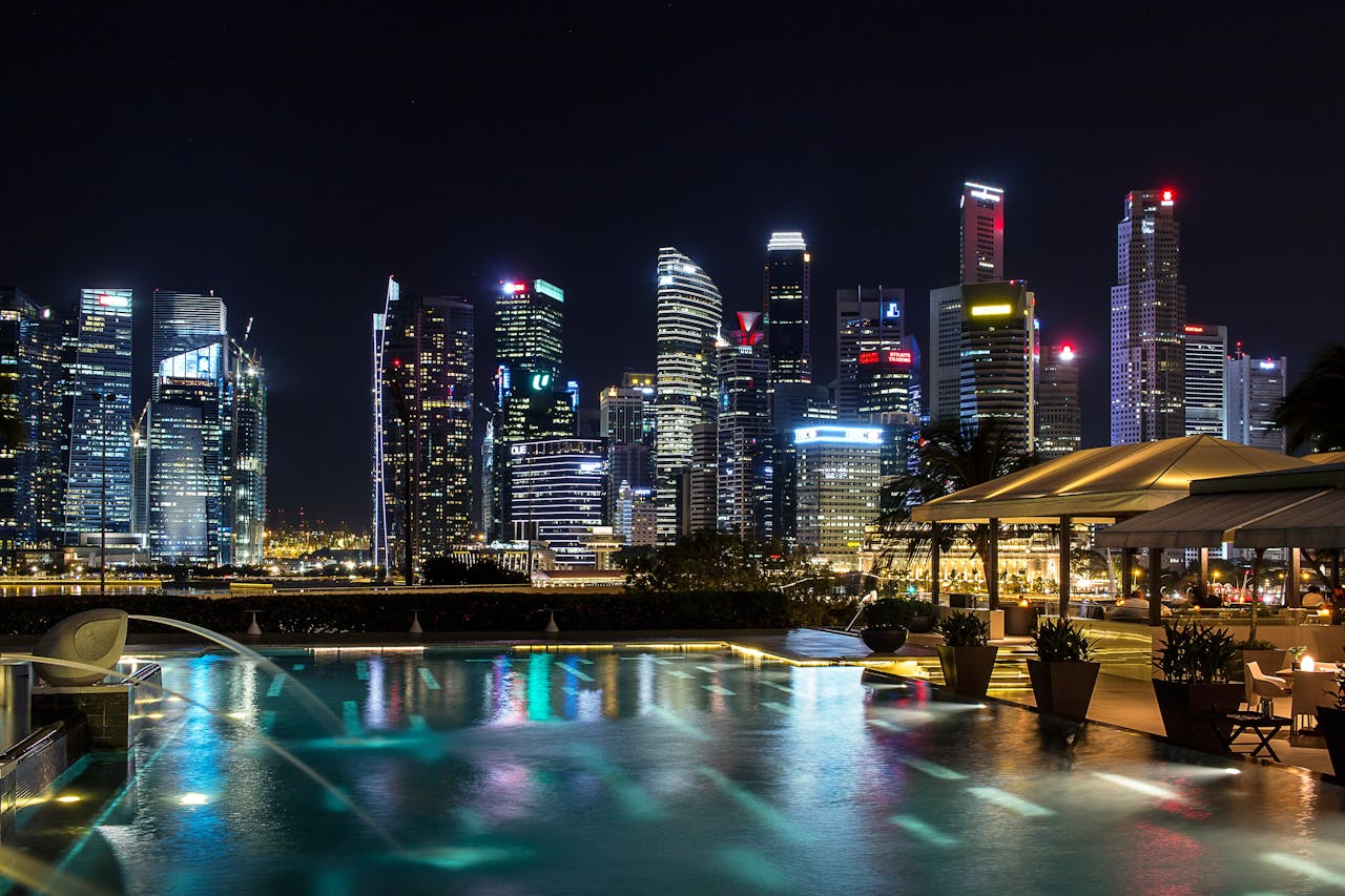 Modern hotel pool overlooking Singapore skyline