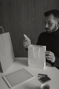 e-commerce man looking at products bought from the internet