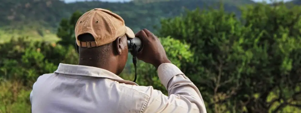 Man looking through binoculars