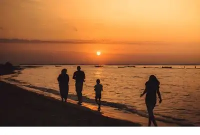 ESG - family walking at sunset