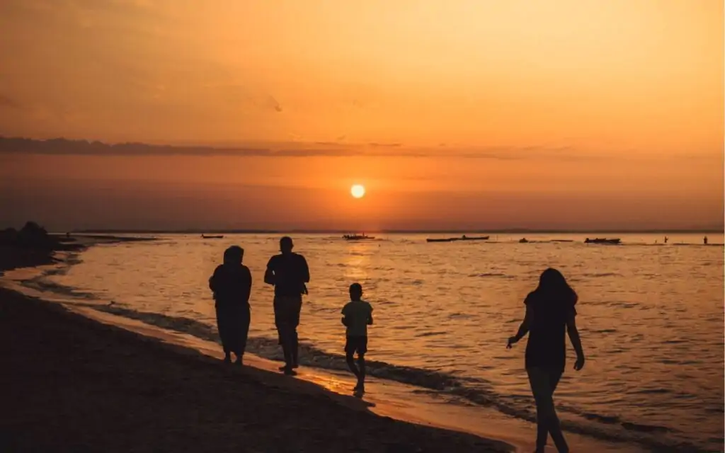ESG - family walking at sunset