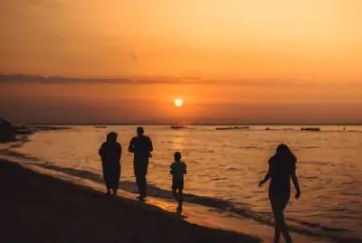 ESG - family walking at sunset