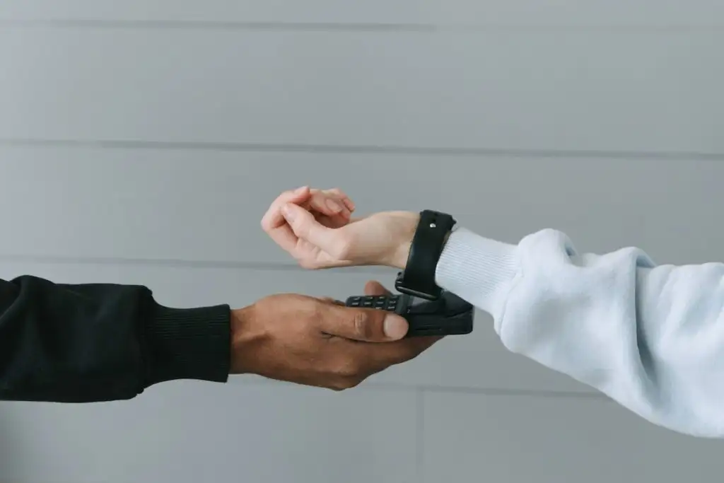 Person Paying Using Her Smartwatch for data transfer