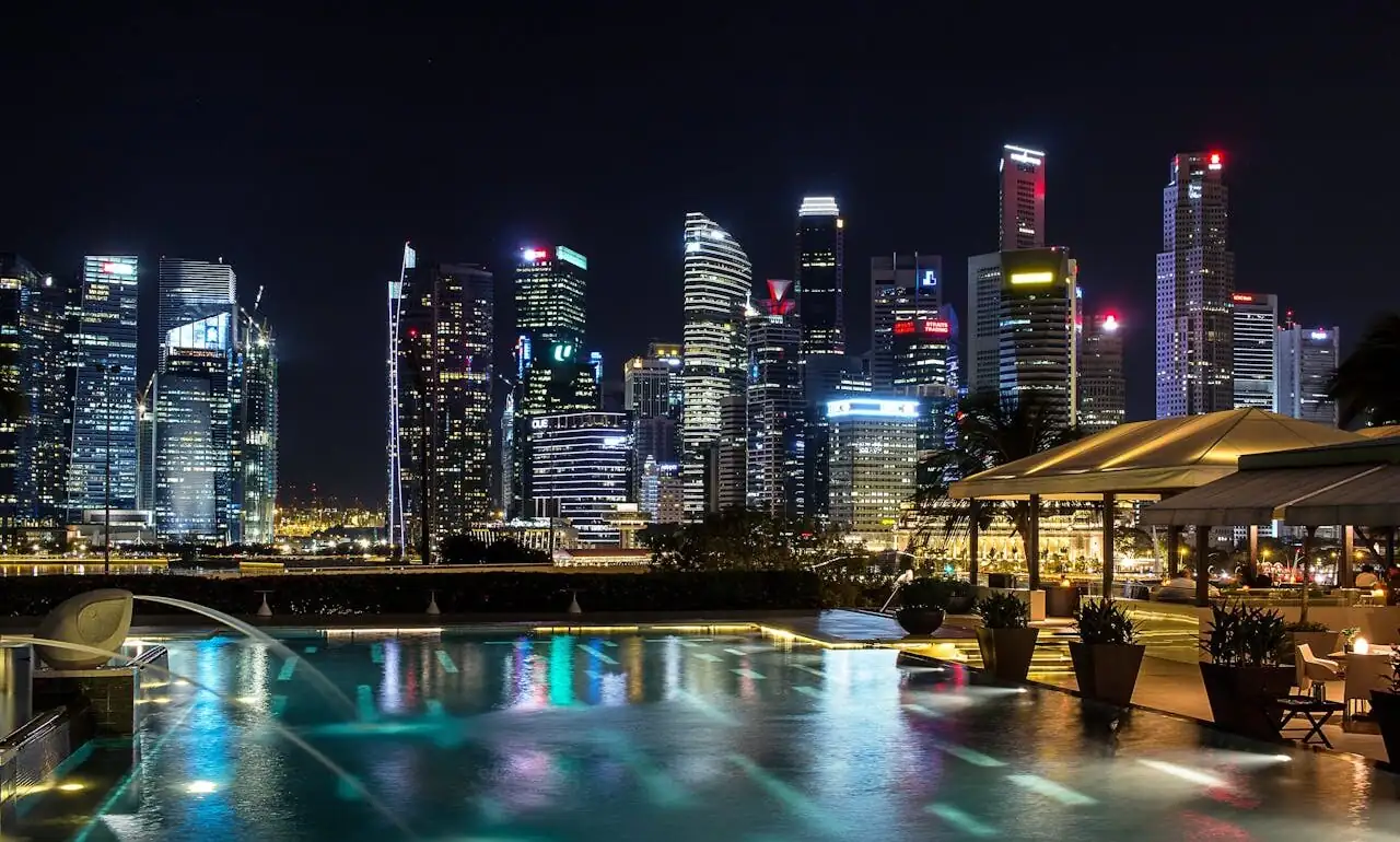 Modern hotel pool overlooking Singapore skyline
